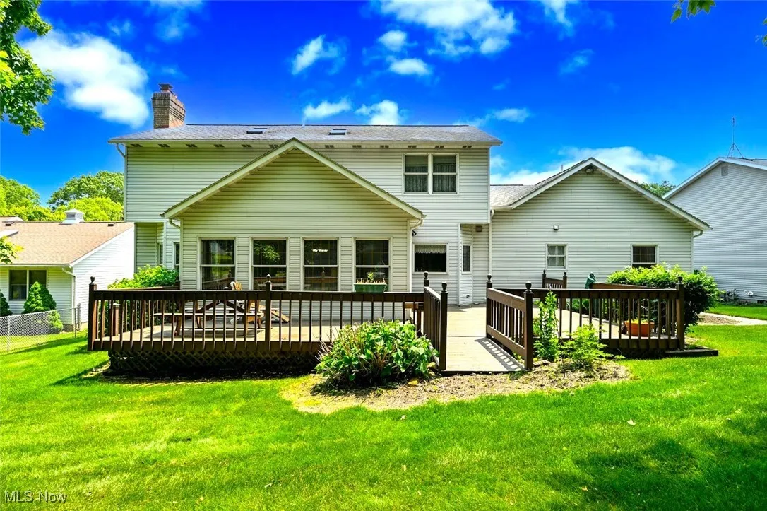*BACK OF THE HOME SHOWING DUAL TIER WRAP AROUND DECK OFF OF SUNROOM! ~