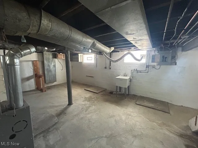 Below grade area featuring heating unit