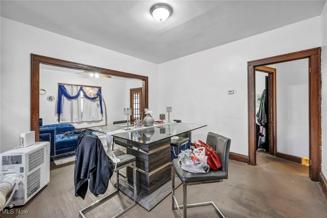 Office area with ceiling fan and baseboards