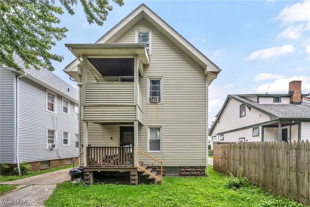 Rear view of property with a balcony