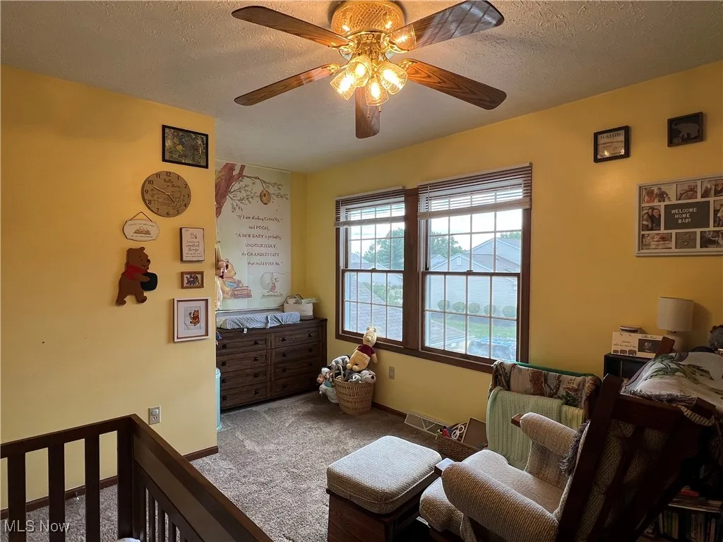Another view of the bedroom. Note the sweet nook for a dresser, desk or comfy chair