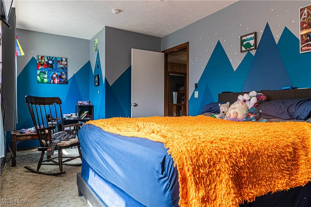 Bedroom featuring a textured ceiling
