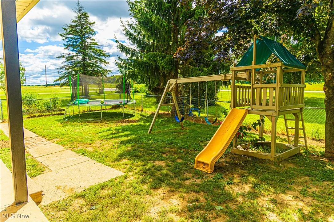 View of play area with a trampoline