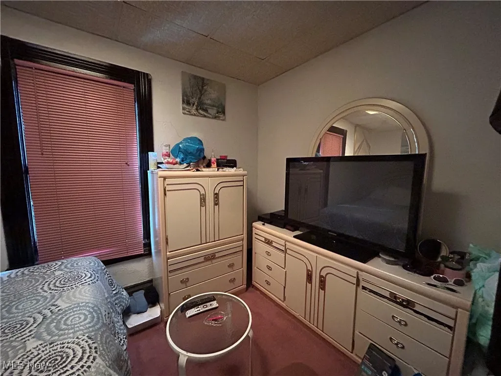 Master Bedroom with a drop ceiling and a closet