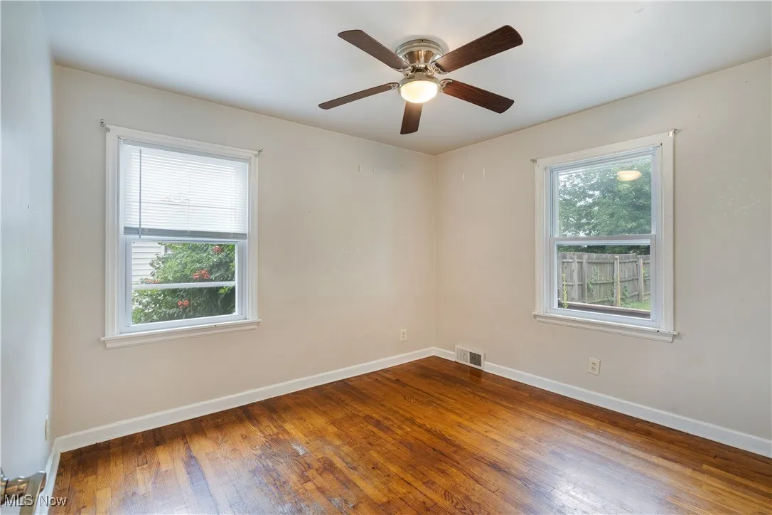 Spare room featuring hardwood / wood-style floors
