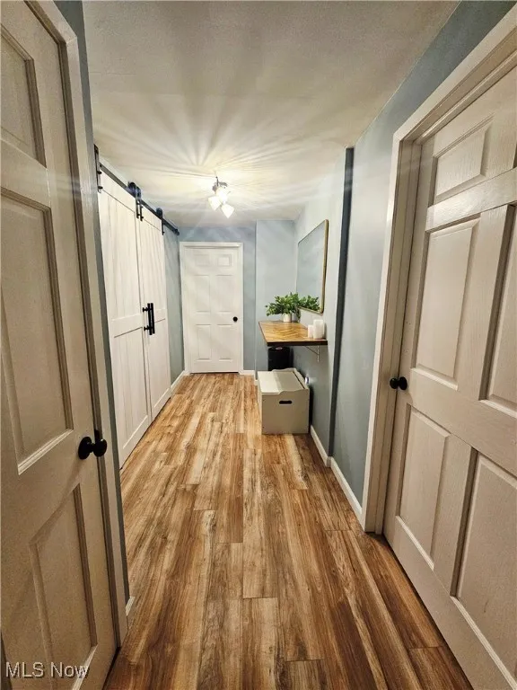 upstiars hallway with floating shelf for folding clothes