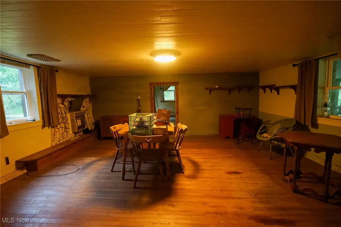 Dining room with hardwood / wood-style floors and wooden ceiling