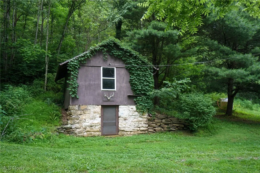 View of outdoor structure featuring a view of trees