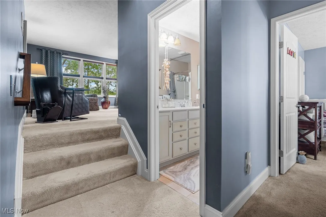 Second floor showing entry into 4th bedroom, full bath, then a step up into the large bonus room