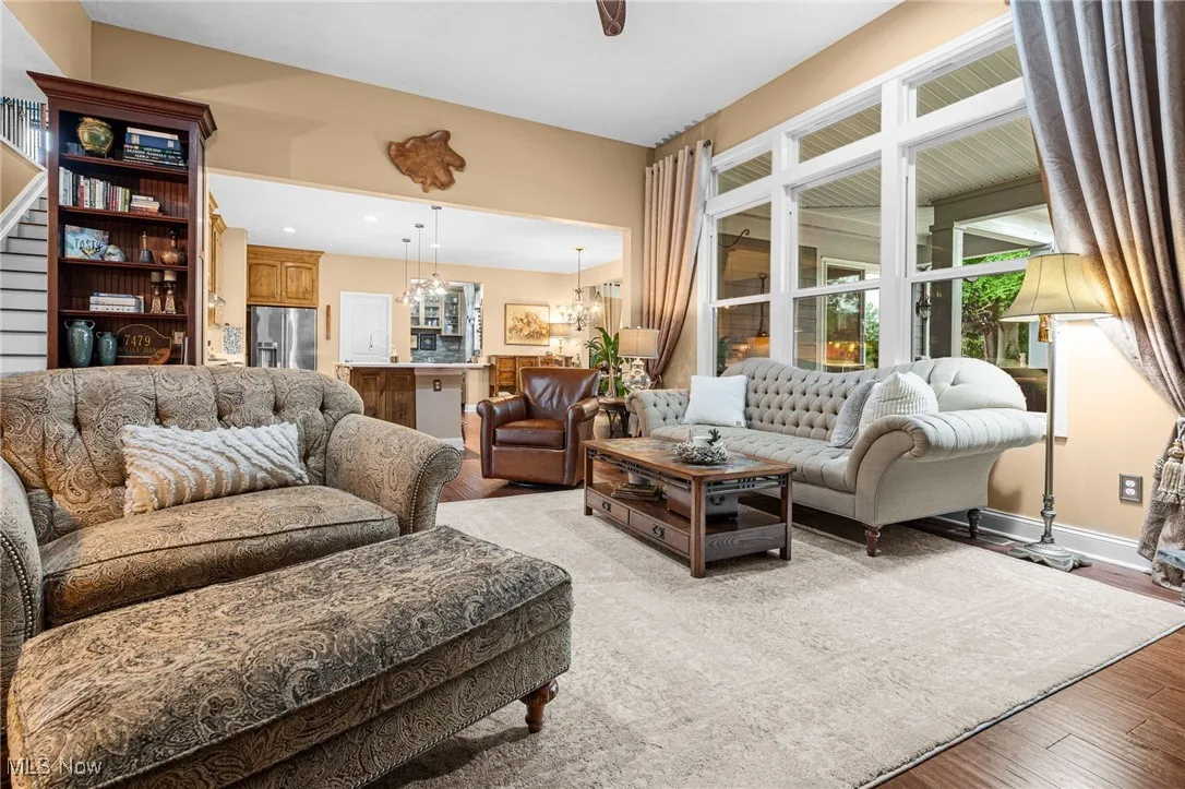 Family room with views of the eat-in kitchen.  Large window overlooking the covered patio.