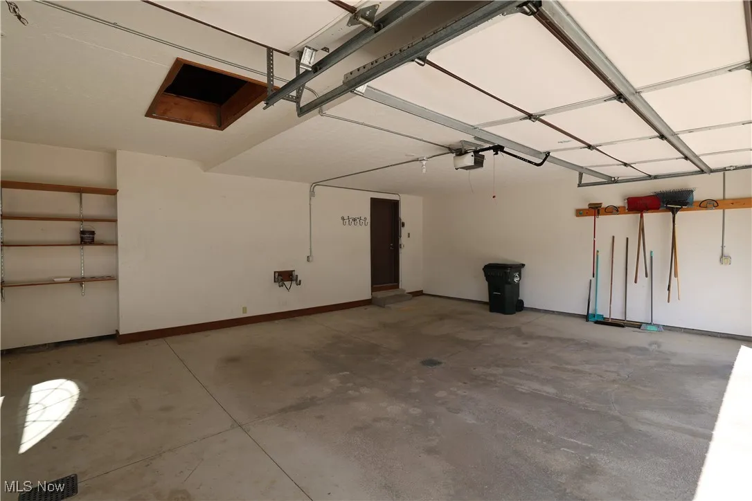 Garage featuring baseboards
