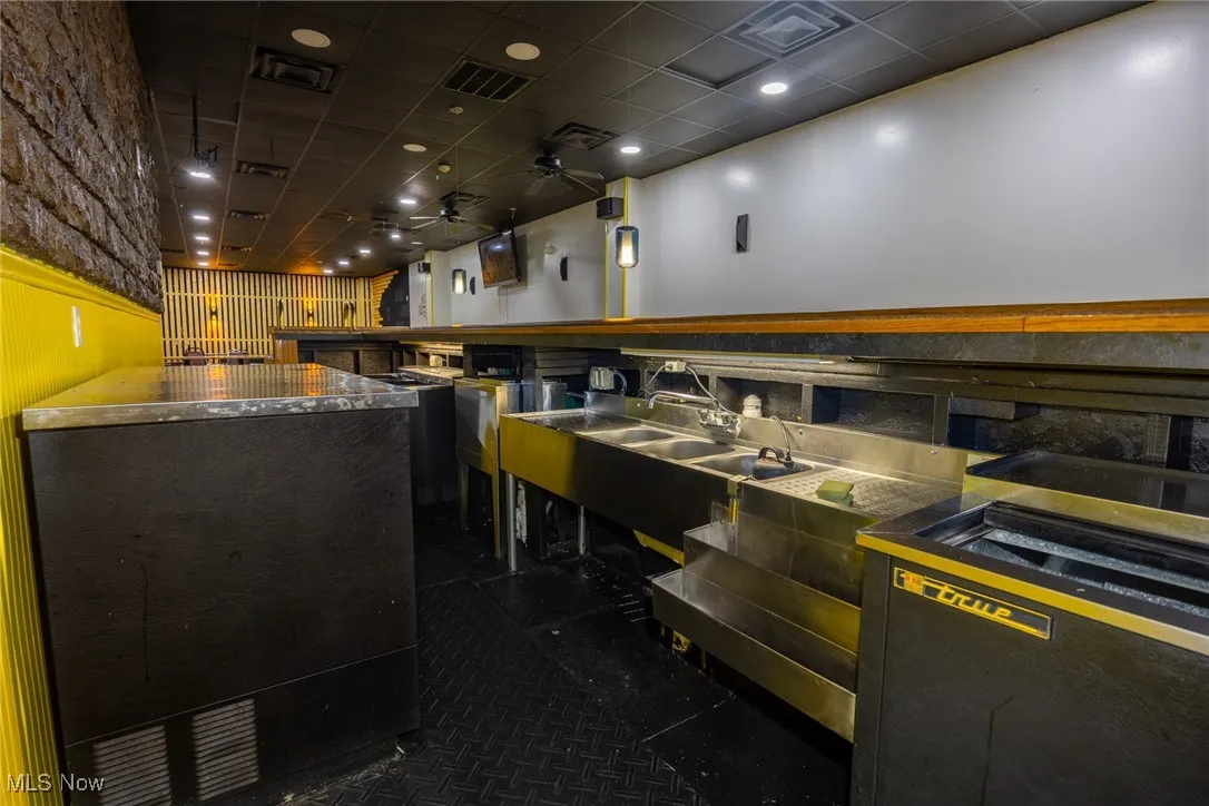 Miscellaneous room featuring a drop ceiling and recessed lighting