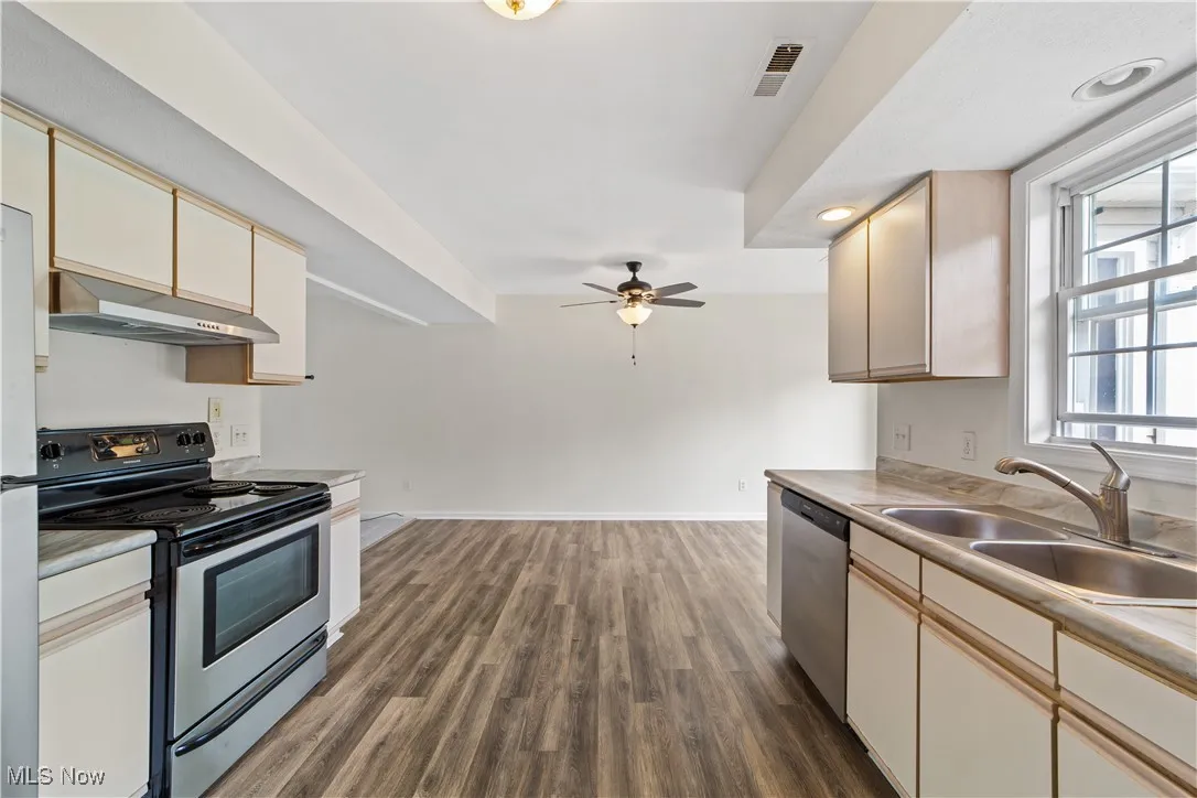 Kitchen with Vinyl Floor and Open to the Dining Room