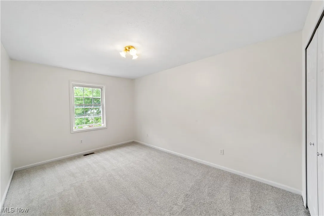 Bedroom with new carpet and freshly painted