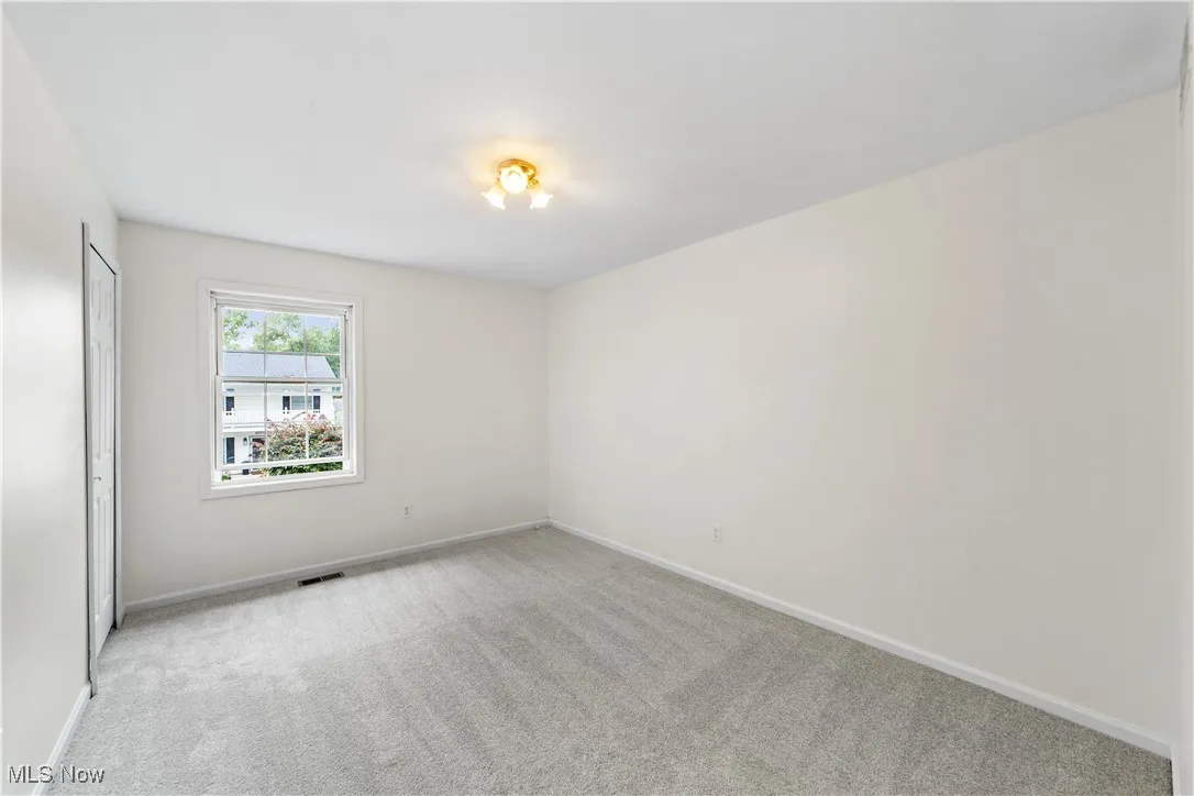 Bedroom with new carpet and freshly painted