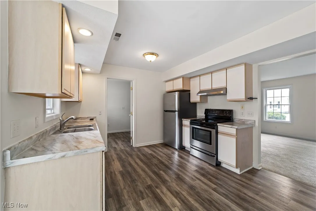 Kitchen with Vinyl Floor and Open to the Dining Room
