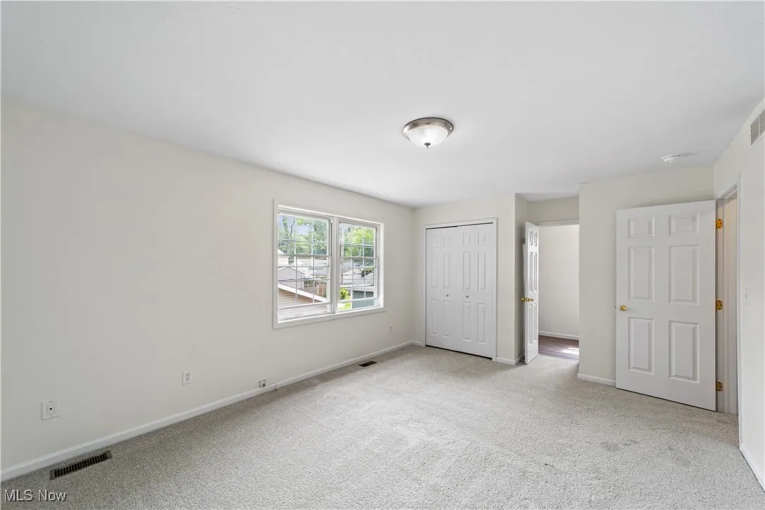 Bedroom with new carpet and freshly painted