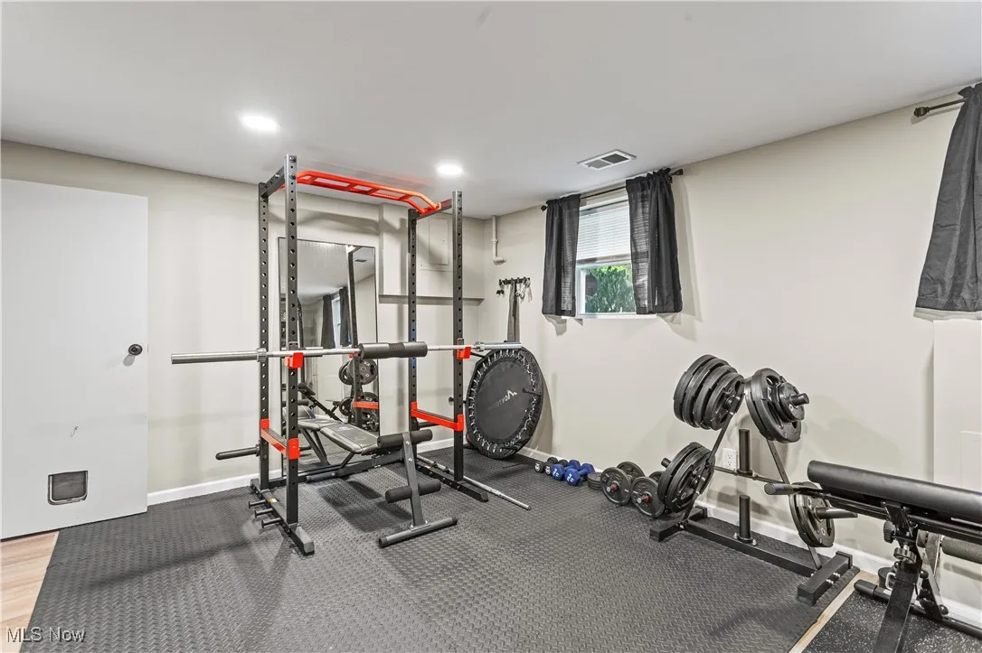 Exercise area with baseboards and recessed lighting