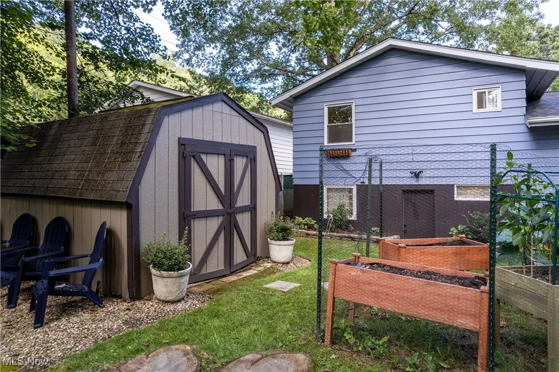 View of shed with a garden