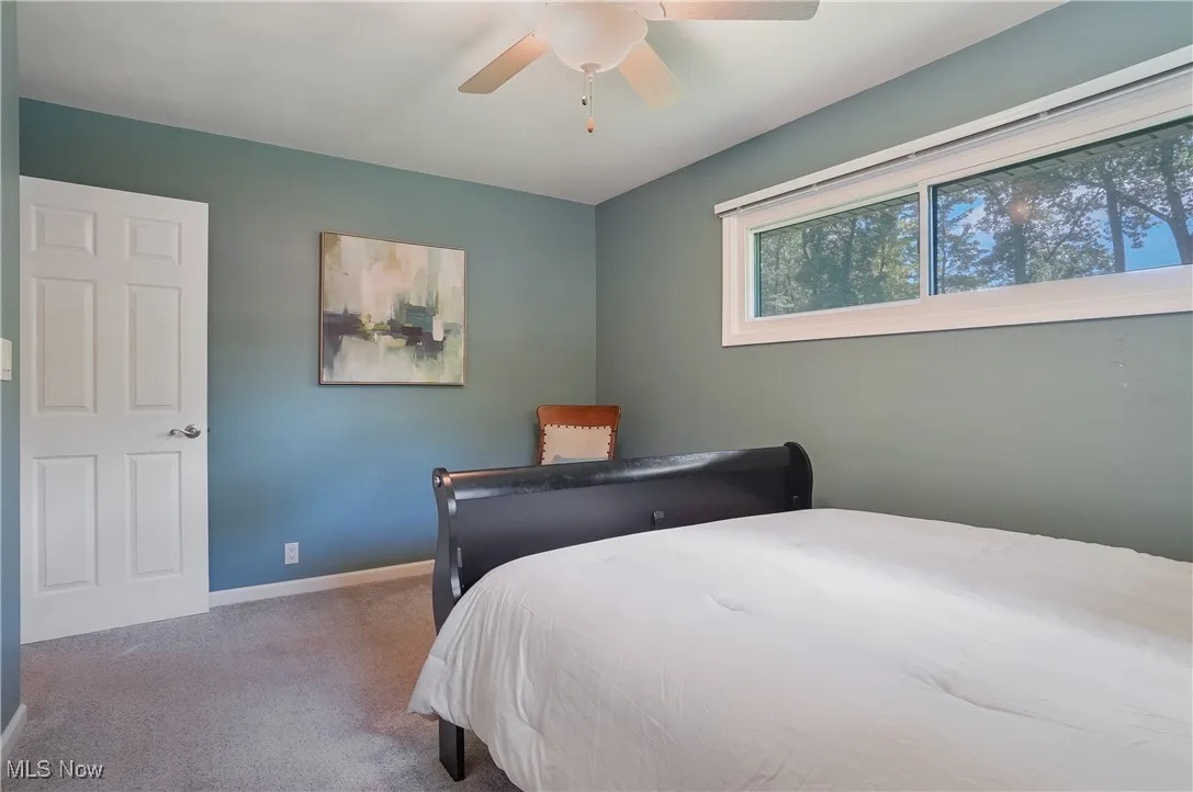 Bedroom with carpet flooring and ceiling fan