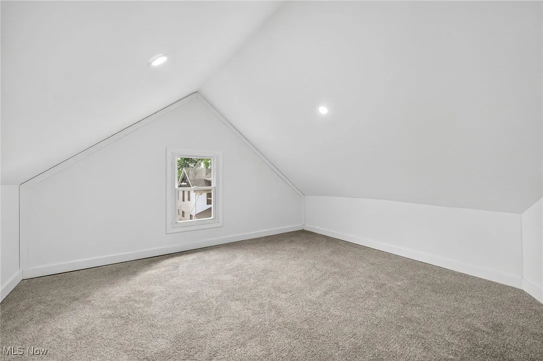 Bonus room featuring carpet, vaulted ceiling, and recessed lighting