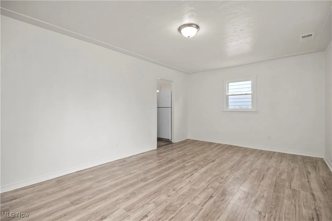 Empty room with light wood-type flooring