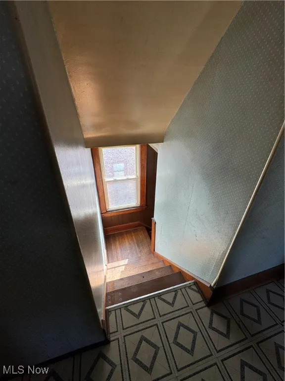 Staircase with tile patterned floors