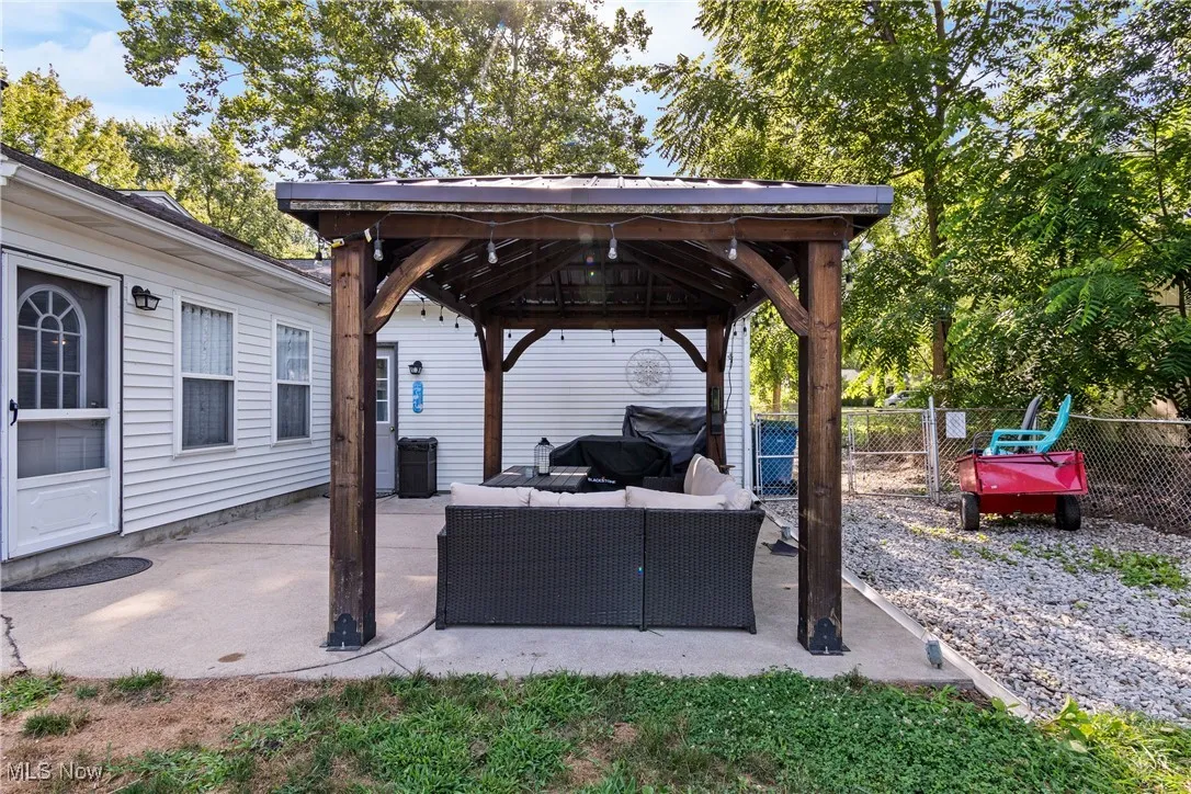 View of patio featuring a gazebo and an outdoor hangout area