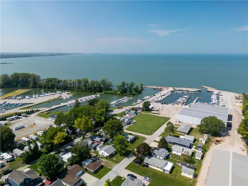 View of property location featuring a marina and a large body of water