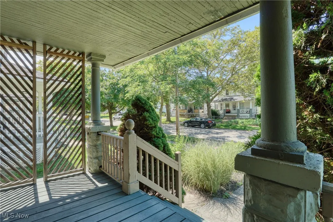 Step up onto the front porch.