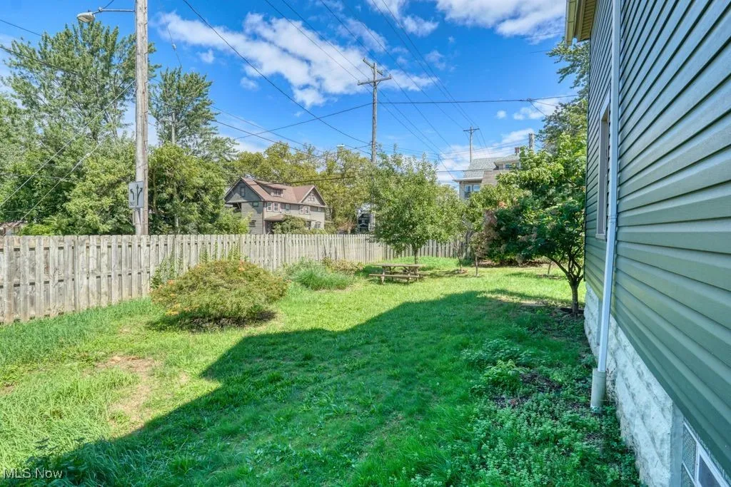 View of mostly fenced backyard add a gate.
