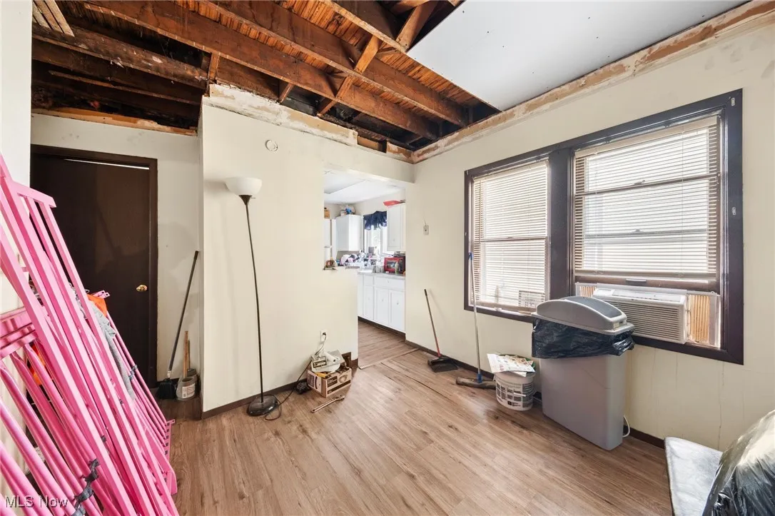 Miscellaneous room featuring light wood-type flooring and baseboards