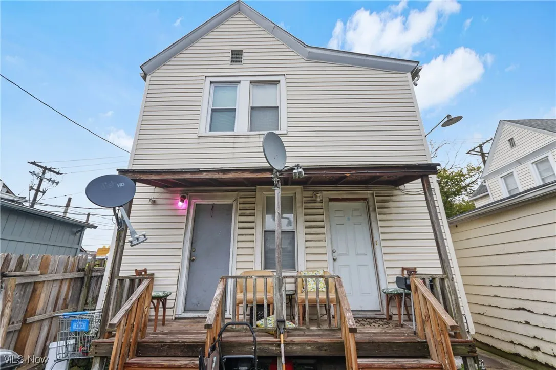 Rear view of house featuring a wooden deck