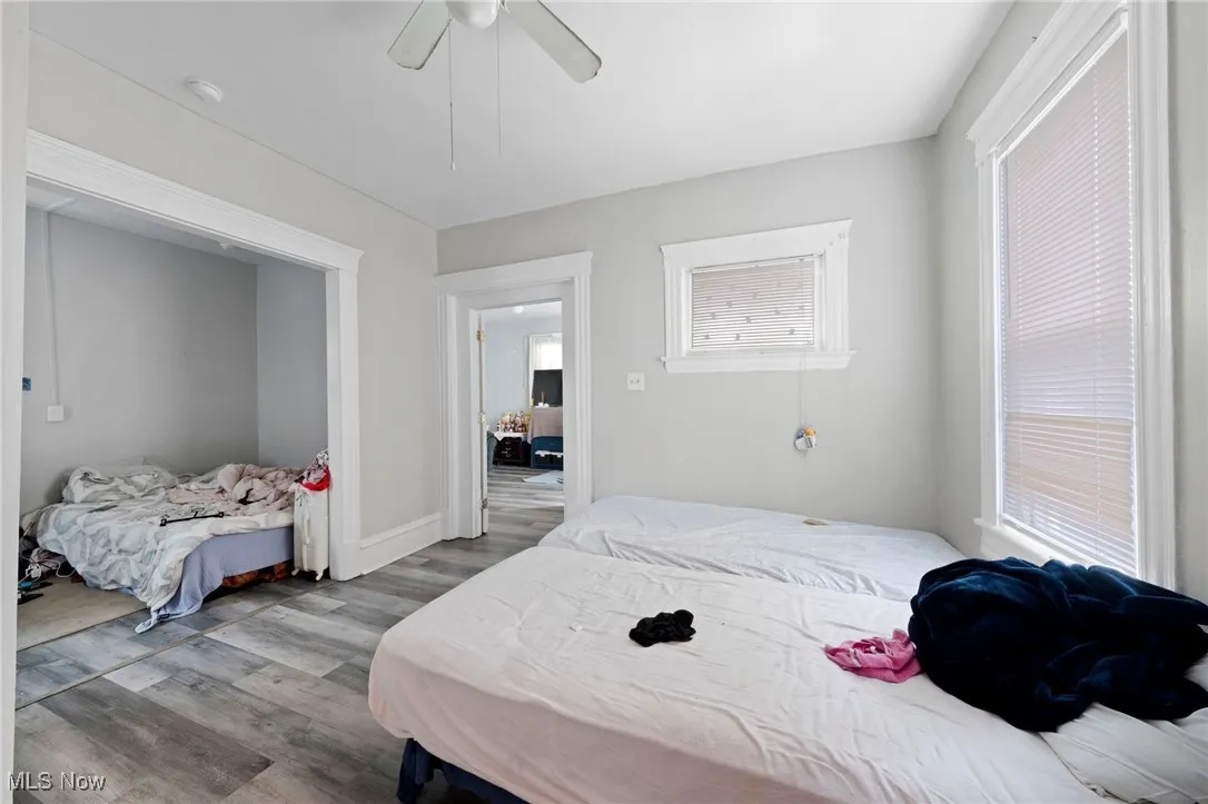 Bedroom featuring wood finished floors and ceiling fan