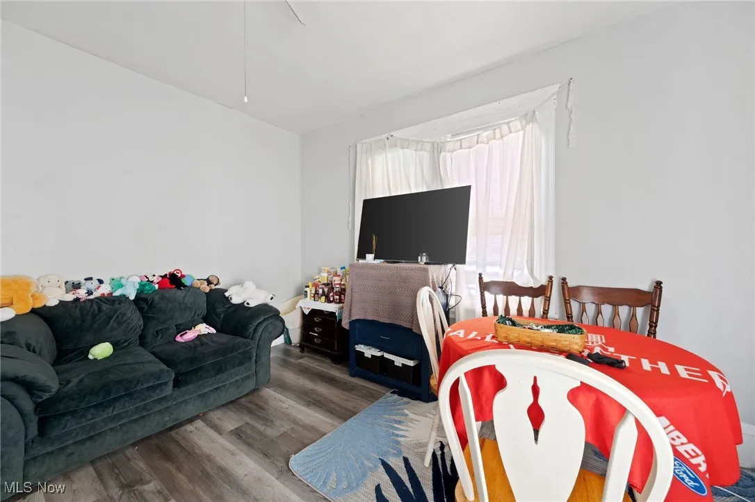 Bedroom featuring wood finished floors, ceiling fan, and vaulted ceiling