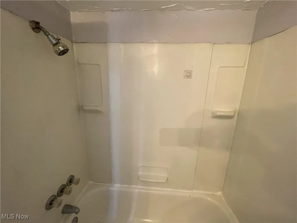 Full bathroom with  shower combination