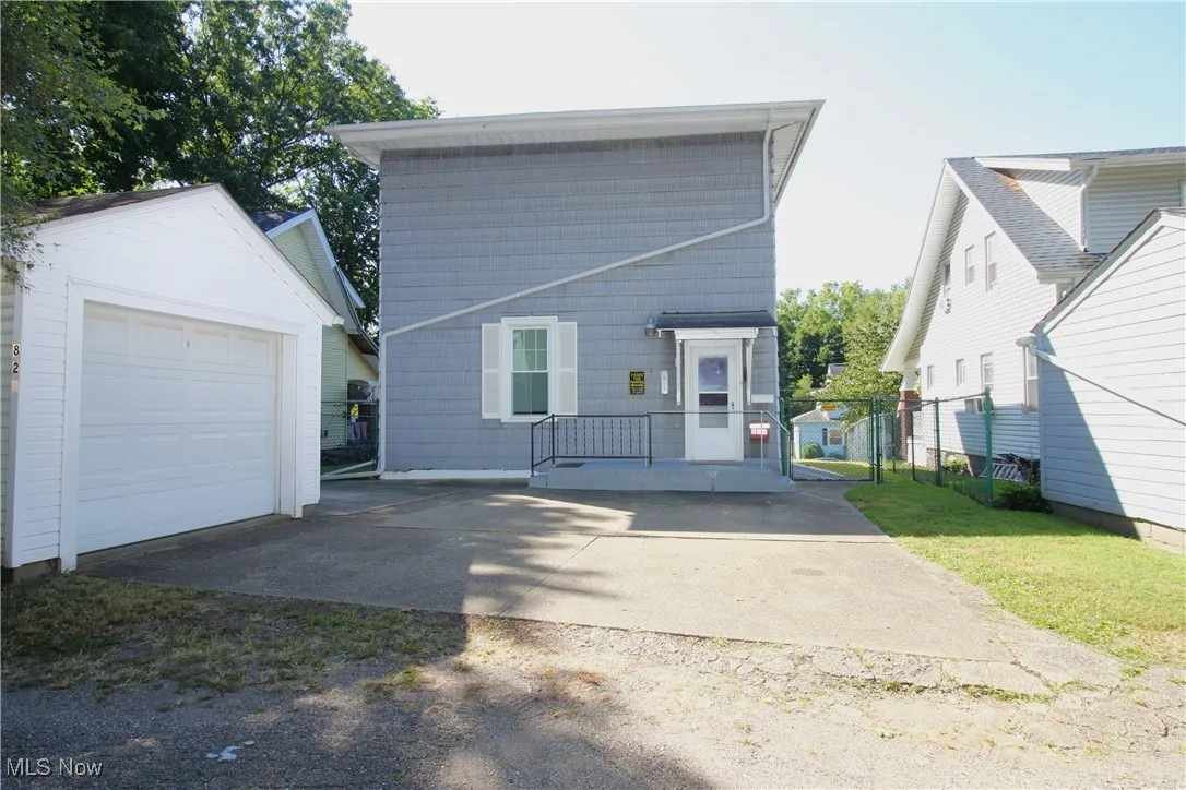 Back of home with garage.