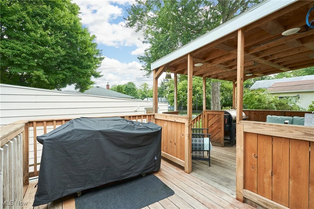 Wooden terrace with area for grilling