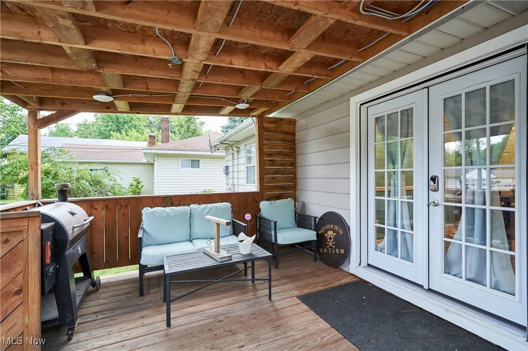 Wooden deck featuring french doors