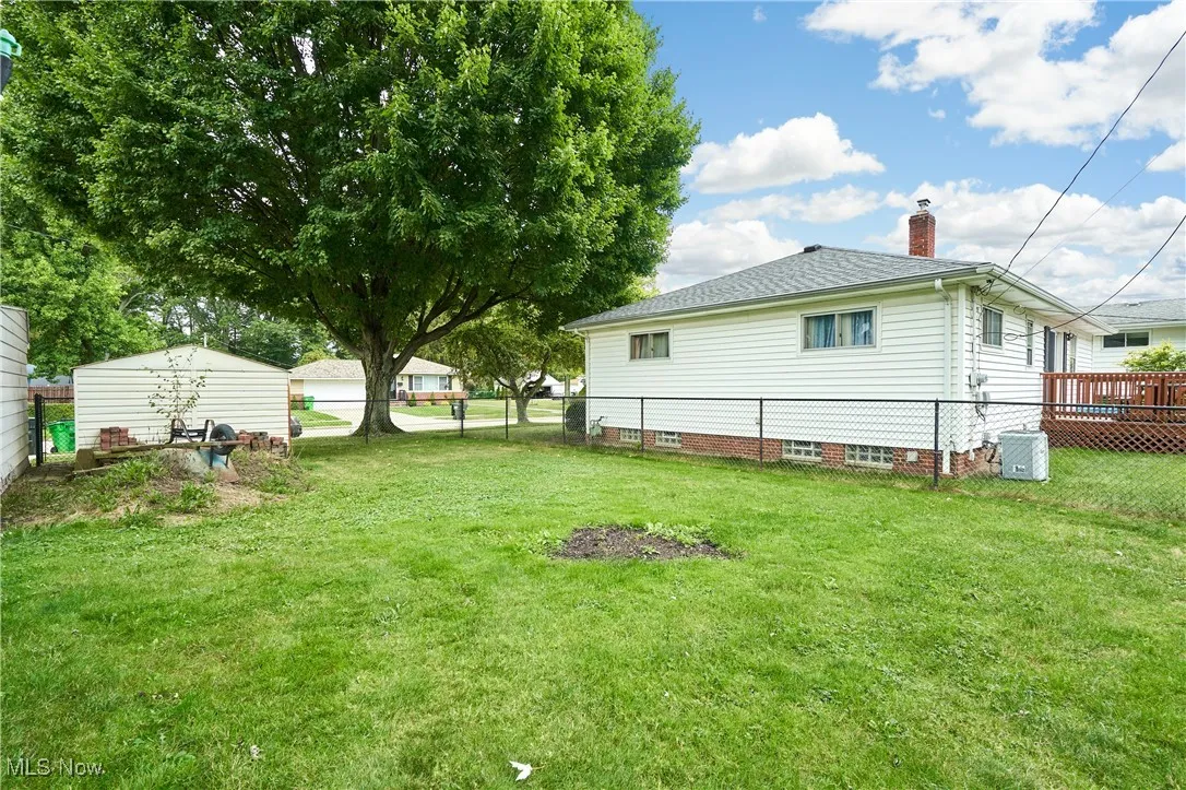 View of yard with a wooden deck