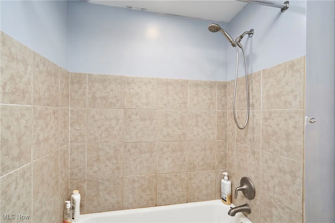 Bathroom with shower / bath combination