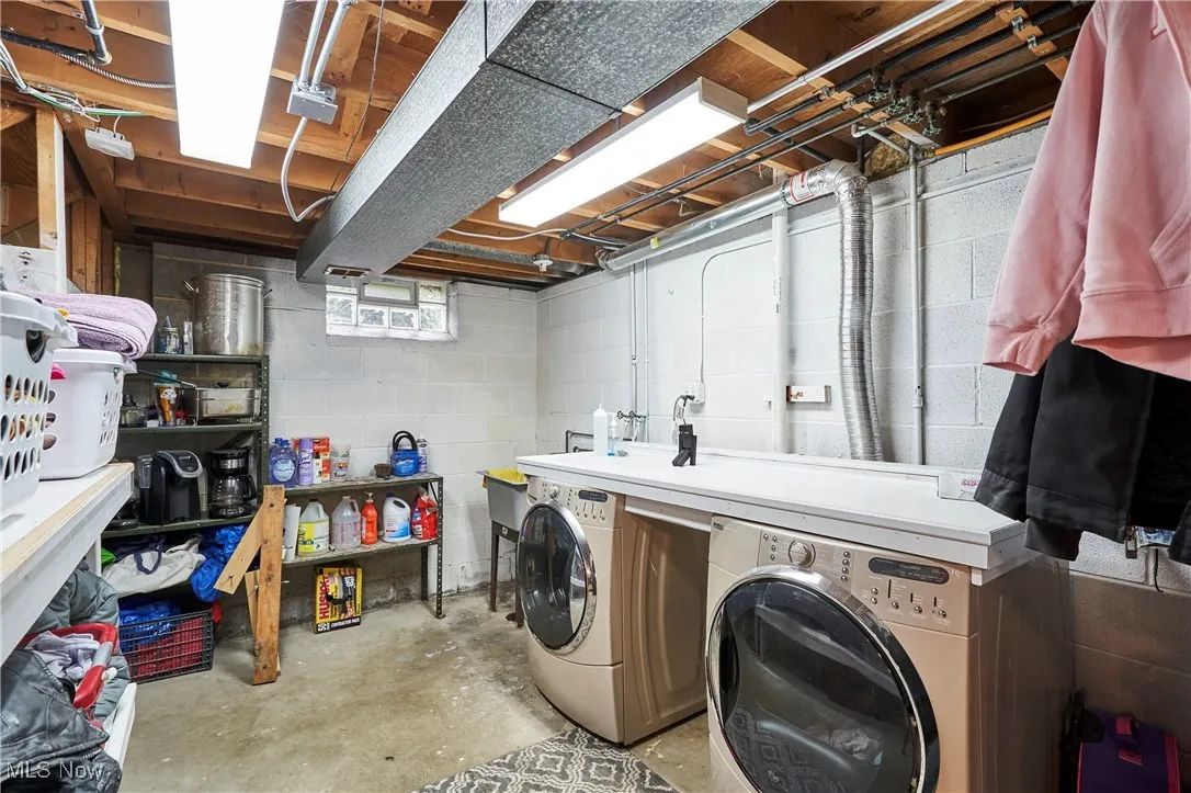 Laundry room featuring washer and clothes dryer