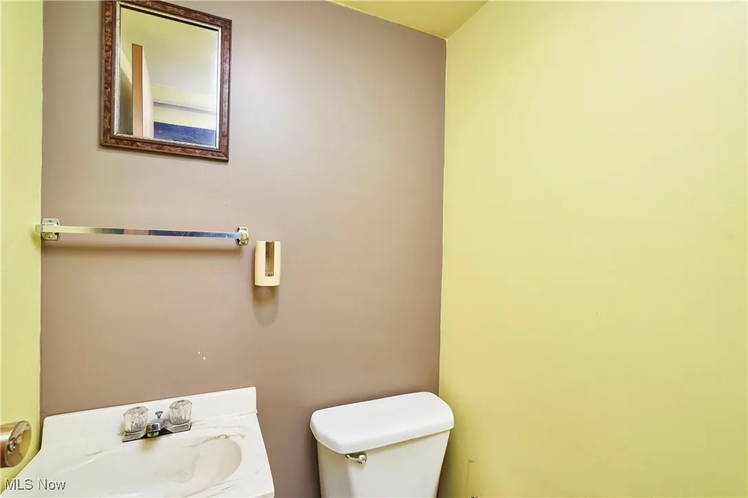 Half bath with toilet and vanity