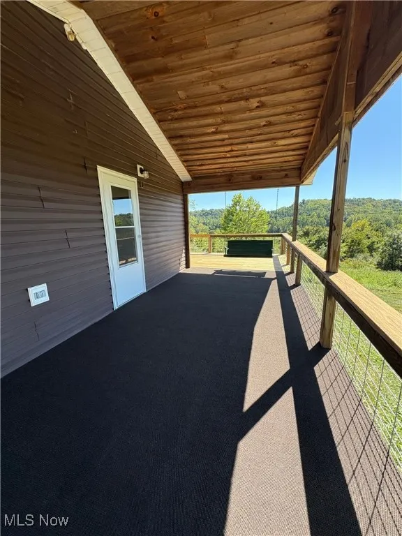 View of patio featuring a wooded view