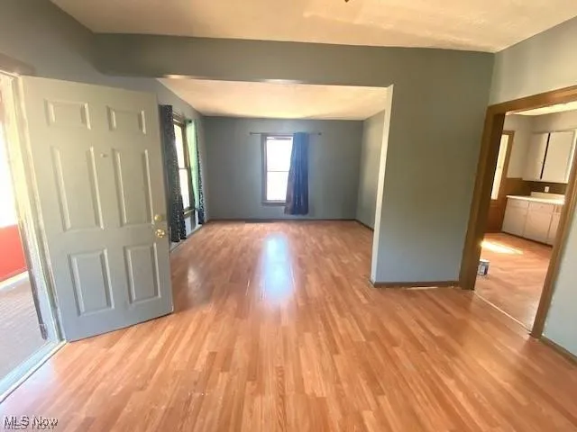 Entrance foyer featuring light wood-style floors and baseboards