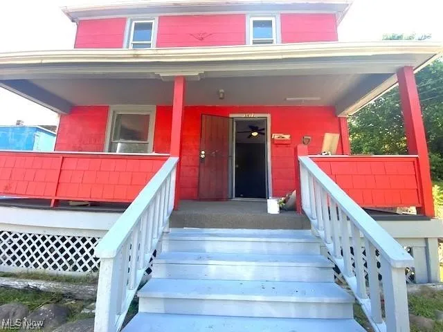 Property entrance featuring covered porch