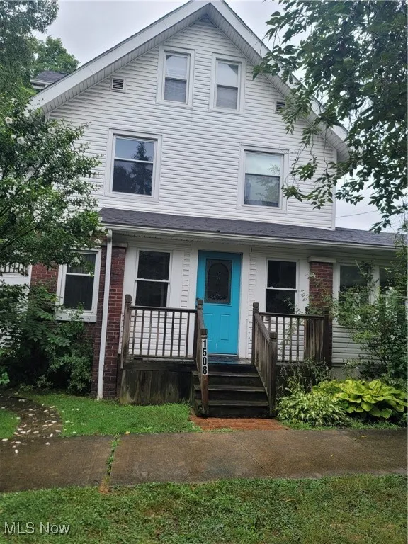 View of front of property with brick siding