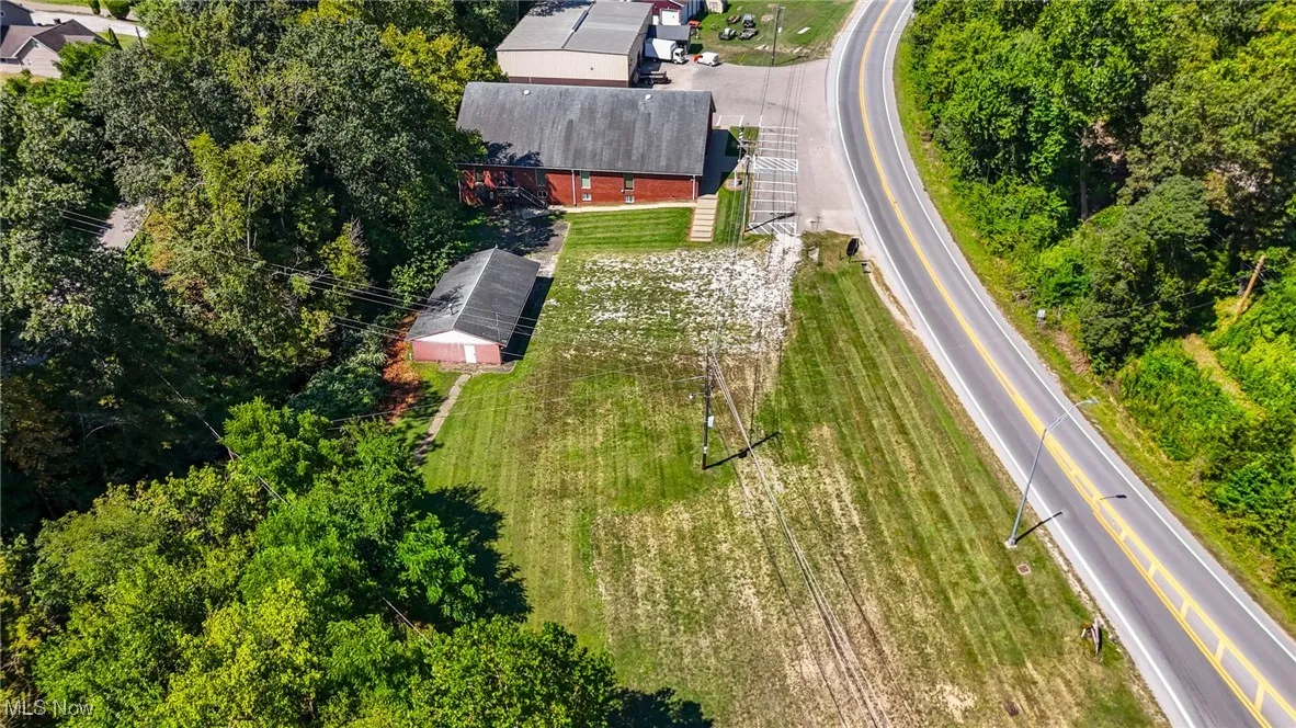 Bird's eye view, gravel area in between buildings great for additional parking