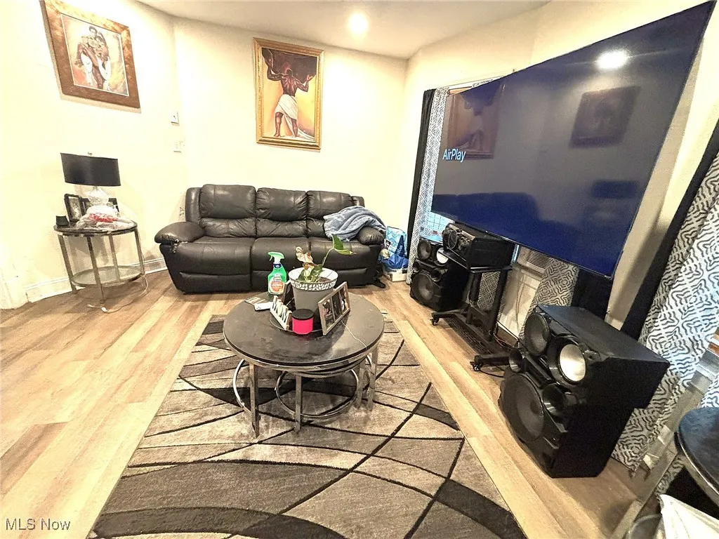 Living room with wood finished floors and baseboards