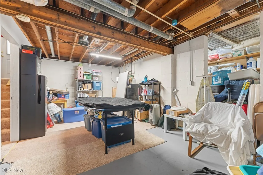 basement featuring stairs